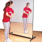 Girl in a red shirt standing in front of a glassless mirror pulling a string from her shoes to her upper body. Glassless Rolling Mirror
